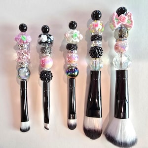 Pink and Black beaded makeup brush set.