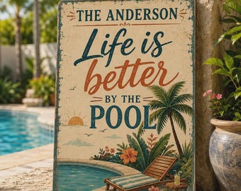 May include: A rectangular metal sign with a distressed cream background featuring the text THE ANDERSON Life is better BY THE POOL. The design includes a graphic of a swimming pool, a wooden lounge chair, a palm tree, and tropical flowers.