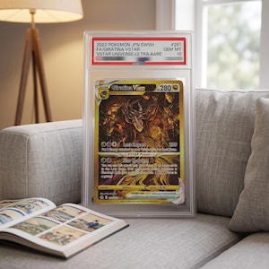 May include: A professionally graded 2022 Pokemon JPN SWSH Giratina VSTAR trading card in a clear plastic slab. The card features gold artwork, 280 HP, and the text 2022 POKEMON JPN.SWSH #261 FA/GIRATINA VSTAR VSTAR UNIVERSE-ULTRA RARE GEM MT 10.