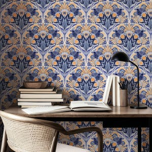May include: Wallpaper featuring a repeating symmetrical floral pattern in shades of navy blue, light blue, and soft orange. The design consists of stylized fan-shaped motifs with central star-like elements and curved petals arranged in a grid.