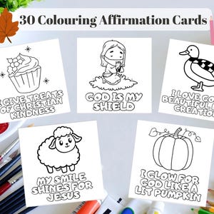 May include: A set of 30 white square colouring affirmation cards featuring black line art illustrations of a cupcake, a praying figure, a duck, a sheep, and a pumpkin, each with religious text including God Is My Shield and My Smile Shines For Jesus.