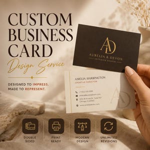 May include: Two rectangular business cards featuring a black card with a gold AD logo and a white card with contact details for Amelia Harrington, Creative Director at Aurelia & Devon Interior Design, including address and website information.