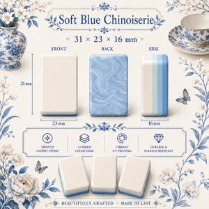 May include: Rectangular tiles labeled Soft Blue Chinoiserie measuring 31 x 23 x 16 mm. The tiles feature a smooth glossy finish, layered color edges, and vibrant UV printing. The front is solid white, the back has a blue marbled pattern, and the side shows blue and white stripes. The set includes six tiles total.