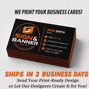 May include: A stack of rectangular business cards with a black background and orange edges. The front features the logo for Sign & Banner Spot, the name John Smith, owner, a phone number, email address, website, and the address 1234 Commerce Way, Edison, NJ 08837.