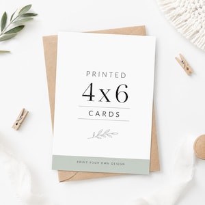 May include: A white rectangular card with black text reading PRINTED 4x6 CARDS, a small line drawing of a leafy branch, and a sage green bottom border with the text PRINT YOUR OWN DESIGN, resting on a brown envelope.