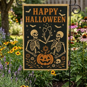 A Halloween-themed garden sign featuring two skeletons holding a jack-o-lantern and surrounded by flowers, with the text "HAPPY HALLOWEEN" displayed prominently.