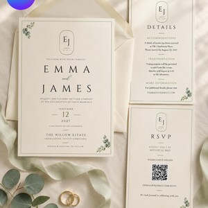 Peut inclure: Un ensemble de faire-part de mariage comprenant une carte principale, une carte de détails et une carte RSVP avec un QR code sur fond blanc cassé. Le papier présente un texte noir à empattement, un monogramme EJ et des feuilles d'eucalyptus.