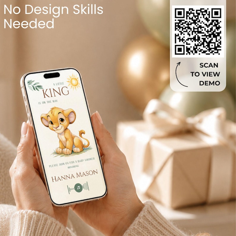 May include: A smartphone displaying a digital baby shower invitation featuring a cartoon lion cub, the text A LITTLE KING IS ON THE WAY, PLEASE JOIN US FOR A BABY SHOWER HONORING HANNA MASON, and a QR code with the text SCAN TO VIEW DEMO.
