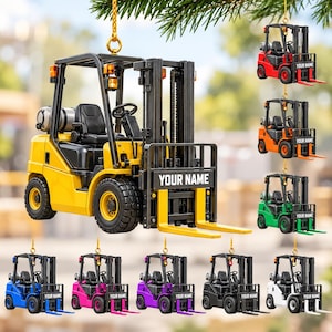 May include: A hanging forklift ornament featuring a black frame, a seat, and a customizable front panel with the text YOUR NAME. The forklift is available in yellow, red, orange, green, blue, pink, purple, black, and white color variations.