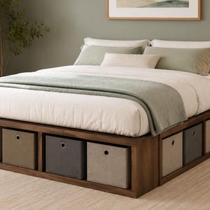 May include: A wooden platform bed frame featuring integrated open storage compartments along the base. The frame contains six fabric storage bins in varying shades of gray and beige, each equipped with a single metal grommet handle for access.