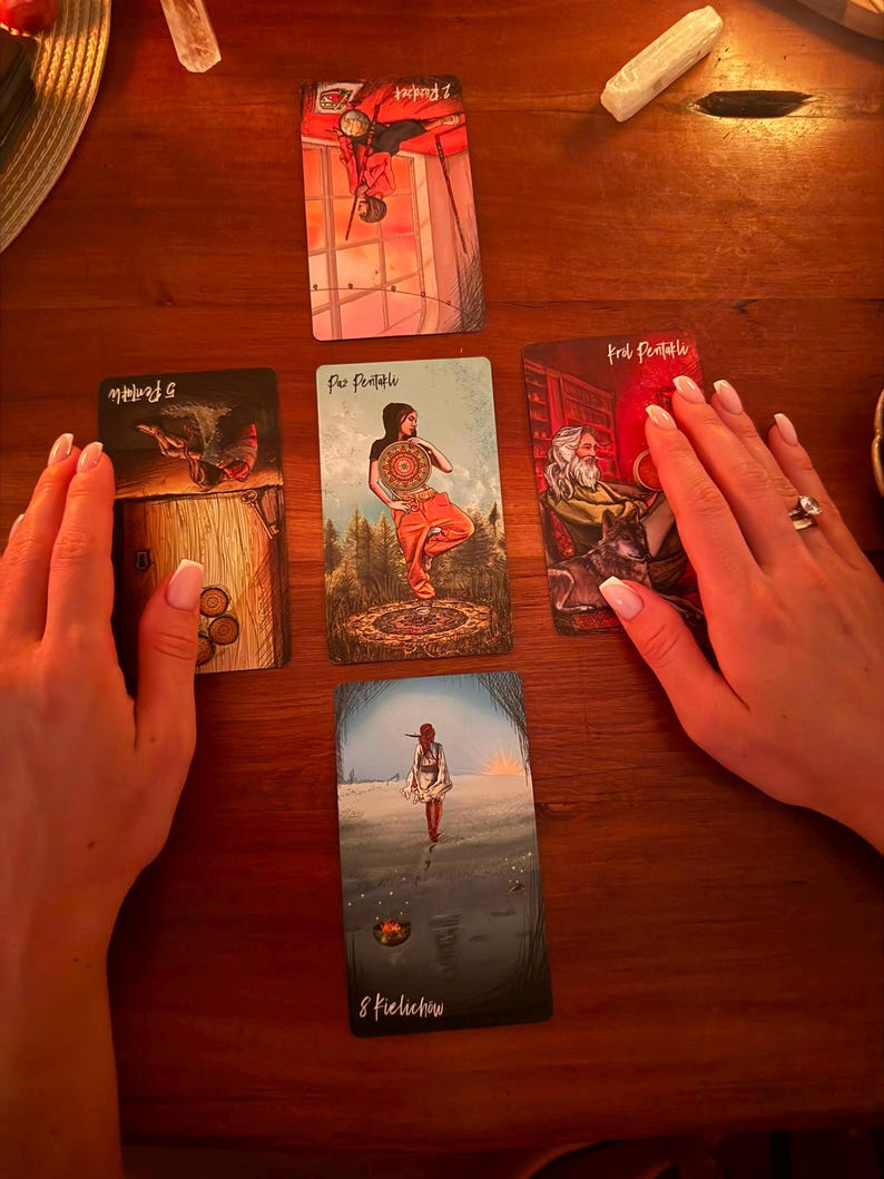 May include: Five tarot cards arranged in a cross pattern on a wooden surface. The cards include the Two of Wands, Five of Pentacles, Page of Pentacles, King of Pentacles, and Eight of Cups, featuring various illustrations of figures and symbols.