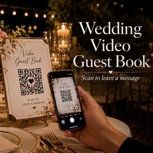 May include: A rectangular sign with a floral border and a QR code, featuring the text "Video Guest Book" and "SCAN TO LEAVE A MESSAGE". A smartphone is held in front of the sign, displaying the same QR code and text on its screen.