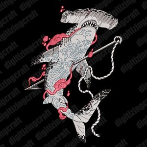 May include: An embroidery design featuring a hammerhead shark with intricate blue line-work tattoos, pierced by a silver anchor and rope. The shark is surrounded by pink cloud-like shapes on a black background. Text reads DIGITIZINGCRAFT.COM.