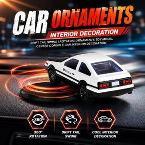 May include: A white and black toy car model designed as a car ornament for a centre console. The vehicle features a hatchback body style, black wheels, and Japanese text on the side door. It is displayed on a circular base with light trails.