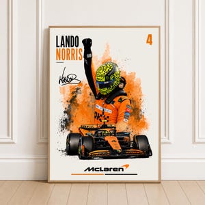 May include: A vertical poster featuring Formula 1 driver Lando Norris in an orange racing suit and a yellow patterned helmet with one arm raised. Below is an orange and black race car with the number 4. Text includes Lando Norris, 4, and McLaren.