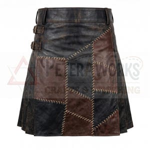 May include: A dark brown and black leather kilt featuring a patchwork design with visible light-colored cross-stitching along the seams. The garment includes a waistband with belt loops and two side buckles. The text PETER WORKS CRAFTS & STITCHING is visible.