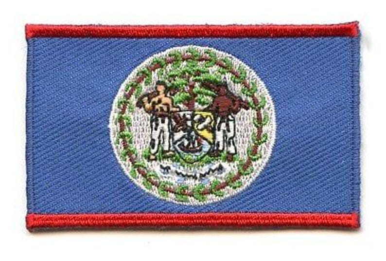 Belize flag patch with blue base, red stripes, white circle, and coat of arms.