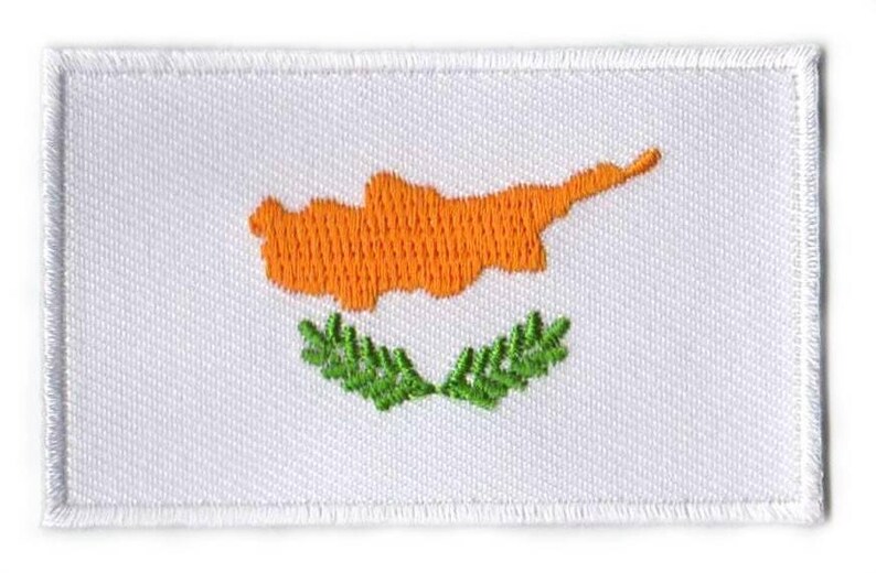 Cyprus flag patch with golden island map and green olive branches on white background.