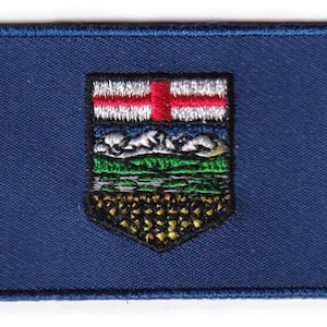 Toppa con la bandiera dell'Alberta
