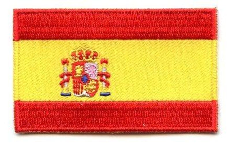 Spain flag patch with red and yellow stripes, featuring coat of arms, 6.5 x 4 cm.