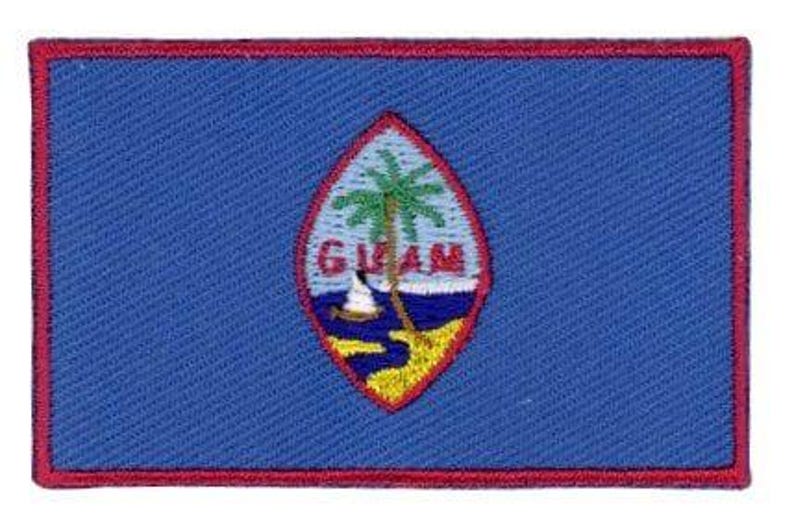 Guam flag patch with blue background, red border, and emblem featuring a proa and palm tree.