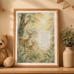 May include: A framed wall art print featuring a watercolor illustration of a deer and a fawn standing in a sunlit forest. The text reads: Trust in the Lord with all thine heart; and lean not unto thine own understanding. In all thy ways acknowledge him, and he shall direct thy paths. Proverbs 3:5-6.