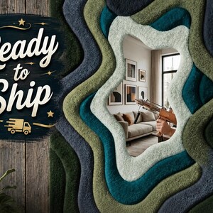 May include: A wall mirror featuring a thick, tufted frame with layered, wavy contours in shades of dark green, teal, and light sage. The text Ready to Ship is printed in white on the left side, accompanied by a small gold truck icon.