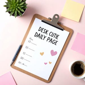 May include: A wooden clipboard holding a white sheet of paper with the black printed text DESK CUTIE DAILY PAGE, featuring several small pink and yellow heart illustrations, alongside a silver pen, a green succulent, and sticky notes.