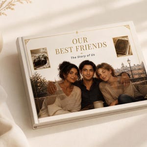 May include: A rectangular photo album with a white cover featuring the gold text "OUR BEST FRIENDS The Story of Us". The cover displays a large central photograph of three people, flanked by two smaller inset images of a camera and a book.