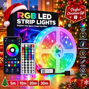 May include: A roll of RGB LED strip lights with a black box labeled RGB LED STRIP LIGHTS, a smartphone displaying a color wheel app, a multi-button remote control, and a USB power controller. The set features 16 million colors, app and remote control, dimmable settings, and flexible indoor use.