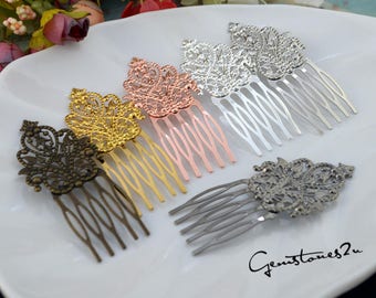 May include: Five ornate hair combs in different metallic finishes: antique brass, gold, rose gold, silver, and gunmetal. Each comb features a delicate, intricate design with a floral motif.