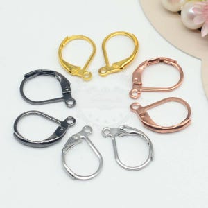 May include: A selection of leverback earring findings in gold, black, silver, and rose gold finishes. These components are for jewellery making and earring design. The image shows a variety of metallic colours.