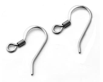 May include: Two silver earring hooks with a spring closure. The hooks are made of metal and are designed to be used with earrings.