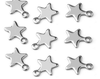 May include: Ten silver star-shaped charms with a loop at the bottom. The charms are about 1 inch in size.