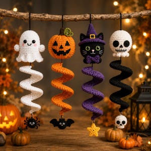 May include: Four crocheted Halloween hanging ornaments suspended from a branch. The set includes a white ghost with a black spider, an orange pumpkin with a black bat, a black cat in a purple witch hat with a yellow star, and a white skull with a black spiral.