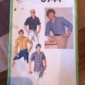 May include: Simplicity sewing pattern number 8944 for shirts. The pattern shows four different shirt styles, including a plaid shirt, a blue shirt, a yellow shirt, and a patterned shirt. The pattern is for size 40.