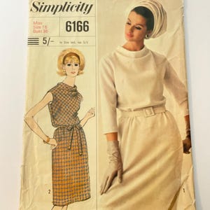 May include: Vintage Simplicity sewing pattern, size 16, with illustrations of two dresses. One is sleeveless with a houndstooth pattern, the other a long-sleeved dress with a skirt. The pattern is labelled "Designer Fashion". Bust 36 inches.