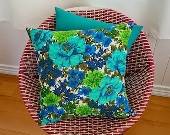 Turquoise and blue flowers cushion cover