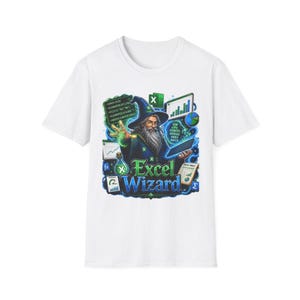 May include: A white t-shirt featuring a graphic of a wizard with a long beard and blue robes. The wizard is surrounded by floating Excel icons, charts, code snippets, and a potion bottle. The text "Excel Wizard" is printed in blue and green.
