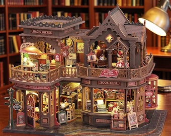 May include: A detailed miniature wooden model of a two-story building featuring a Magic Coffee shop and a Corner Book Store. The structure includes intricate architectural details, illuminated interior rooms, miniature furniture, and signage reading Magic Coffee, Wonderful Coffee House, and Corner Book Store.