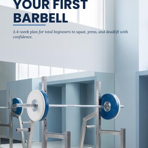 May include: A book cover titled RNAEBOOKS STRENGTH BASICS BOOK 1 YOUR FIRST BARBELL A 4-week plan for total beginners to squat, press, and deadlift with confidence. The image shows a metal barbell rack with blue and white weight plates.