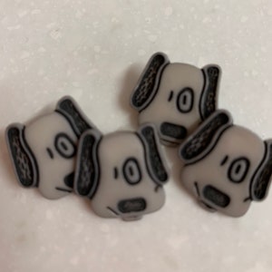 Four Small Gray and Black Plastic Puppy Dog Buttons Self Shanks BT1110