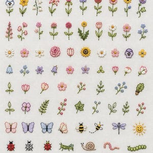 May include: A white fabric sampler featuring rows of embroidered motifs including various colourful flowers, green leaves, butterflies, bees, a dragonfly, a sun, insects, mushrooms, a bird, a birdhouse, a trowel, a seed packet, and a rainbow.