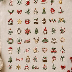 May include: A beige fabric sampler featuring a grid of small, colourful embroidered Christmas icons including presents, snowflakes, stockings, holly, Santa hats, candy canes, bells, trees, gingerbread people, reindeer, snowmen, and ornaments.