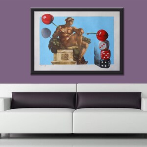 May include: A framed print of a surrealist painting depicting a sculpture of a man holding a cherry, with another cherry balanced on top of a stack of dice.