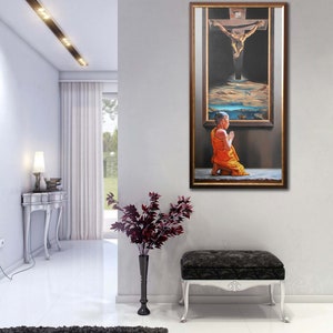 May include: A framed painting depicting a man on a cross with a monk kneeling in prayer in front of the cross. The painting is set against a dark background with a sky and clouds in the background.