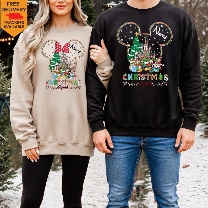 May include: A beige sweatshirt and a black sweatshirt, each featuring a graphic of a Mickey Mouse silhouette filled with a Christmas castle, a tree, and cartoon characters. The text "Name" and "Christmas Squad" are printed on both garments.