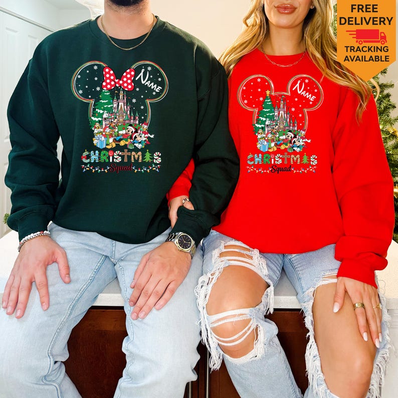 May include: A dark green sweatshirt and a red sweatshirt, each featuring a graphic of a Mickey Mouse silhouette filled with a Christmas castle, characters, and the text "Name" and "CHRISTMAS Squad" with colorful holiday lights and snowflakes.