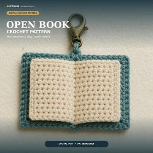 May include: A crochet open book keychain and bag charm with a teal border and cream-colored pages. The item features a bronze-toned metal lobster clasp at the top. Text on the image reads: GUERRAM PATTERN STUDIO, DIGITAL CROCHET PATTERN, OPEN BOOK, CROCHET PATTERN, Mini Keychain & Bag Charm Tutorial, DIGITAL PDF, PATTERN ONLY.
