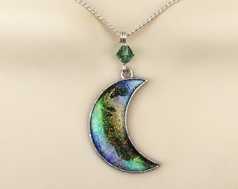 Crescent moon necklace in blue, green and brown with sparkling iridescent enamel finish.